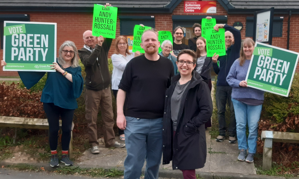 Andy Hunter-Rossall, Chorley South West candidate, and Carla Denyer, co-leader of the Green Party, with other members and supporters outside Buttermere Community Centre
